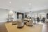 Elegant and spacious lounge area with modern decor, featuring plush seating and large windows offering stunning views of the courtyard.