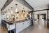 Elegant modern apartment with a chic bar area, stylish pendant lighting, and an open living space perfect for gatherings.