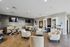 Elegant communal lounge featuring plush seating, sleek modern decor, and ample workspace with dual wall-mounted TVs.