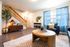 Bright, modern living room with chic decor, cozy seating, and stylish accent pieces, inviting warmth and comfort.