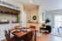 Inviting apartment interior featuring a cozy dining area, stylish living room, and convenient in-unit laundry space.