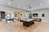 Inviting recreational room featuring a sleek pool table, modern ping pong setup, and stylish decor for ultimate relaxation.