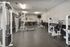 Modern fitness center equipped with state-of-the-art gym equipment, sleek design, and ample workout space.