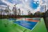 Inviting outdoor pickleball courts surrounded by lush greenery, perfect for sports enthusiasts looking to enjoy the scenic views and fresh air.