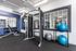 Modern fitness center equipped with diverse workout machines and exercise balls, offering an inviting space for your health and wellness routines.