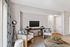 Chic living room with cozy seating, stylish decor, and a warm, inviting atmosphere.