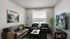 Inviting living room with modern furniture, vibrant artwork, and a large window showcasing natural light.