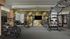 Modern fitness center with state-of-the-art exercise equipment, vibrant decor, and ample natural light.