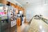 Charming kitchen with warm wooden cabinets, granite countertops, and sleek stainless steel appliances, perfect for culinary adventures and cozy gatherings.