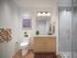 Sleek modern bathroom with elegant fixtures, glass shower, and stylish decor accents for a serene retreat.