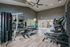 Modern fitness center featuring state-of-the-art gym equipment, sleek design, and ample natural light.