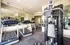 Modern fitness center with state-of-the-art treadmills, exercise equipment, and mirrored walls for an enhanced workout experience.