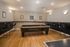 Modern game room featuring a sleek pool table, cozy seating area, and stylish decor for ultimate entertainment.