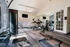 Modern fitness center with state-of-the-art equipment, natural light, and stylish decor for an invigorating workout experience.