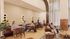 Chic co-working lounge with modern furniture and natural light, perfect for productivity and socializing.