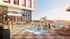 Luxurious rooftop pool with chic lounge chairs and a vibrant social atmosphere, perfect for relaxing and enjoying stunning city views.