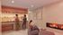 Inviting cozy room featuring a sleek fireplace, modern lounge seating, and a stylish beverage bar perfect for relaxation and socializing.