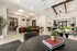 Inviting apartment lobby with stylish decor, elegant seating, lush green plants, and modern lighting, offering a warm and welcoming ambiance.