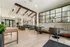 Elegant and inviting community lounge with plush seating, chic decor, and abundant natural light, perfect for relaxation and socializing.