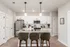 Modern kitchen with sleek white cabinets, granite countertops, and stylish pendant lighting, perfect for entertaining.