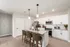 Bright modern kitchen with sleek white cabinetry, granite countertops, and stainless steel appliances.