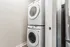Modern apartment feature: sleek stackable washer and dryer unit in a stylish laundry nook.