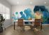 Modern office space with vibrant blue mural and stylish seating, showcasing creative and inspiring work environment.