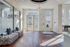 Bright and elegant common area with modern decor, stylish lighting, and expansive windows offering beautiful views.
