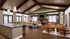 Elegant apartment interior with vaulted ceilings, a stylish kitchen island, and cozy seating areas, complemented by a warm fireplace and abundant natural light.