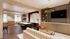 Elegant open-concept living and dining area featuring stylish kitchen island, cozy seating, and contemporary decor.