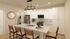 Chic and modern kitchen with a sleek island, stylish pendant lighting, and elegant cabinetry, perfect for culinary creativity.