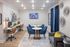 Chic apartment space featuring a modern media room with cozy seating, stylish decor, and a functional workstation.