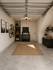 Modern garage with organized tools, storage shelves, and a mounted bike, creating a sleek and functional workspace.