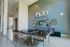 Vibrant recreation room featuring a sleek ping pong table, stylish wall art, and a playful ambiance inviting social interaction.