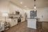 Modern kitchen featuring sleek cabinetry, stainless steel appliances, and a stylish breakfast bar with pendant lighting, perfect for culinary enthusiasts.