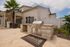 Modern outdoor barbecue area at Stillwell at Pasco Station with sleek stainless steel grill and inviting patio space, perfect for entertaining under sunny skies.