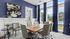 Elegant meeting room with a natural wood table, modern chairs, and large windows offering a scenic view.