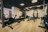 Modern fitness center equipped with cutting-edge gym equipment and sleek interior design for an invigorating workout experience.
