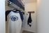 Spacious walk-in closet with stylish shelving and modern design for organized living.