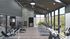 Luxurious fitness center with panoramic mountain views, featuring state-of-the-art treadmills and modern weightlifting equipment.