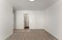 Bright and inviting room featuring plush carpeting and an accessible en-suite bathroom.