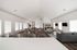 Spacious communal lounge with elegant seating, modern decor, and abundant natural light, ideal for relaxation and social gatherings.