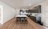 Chic modern kitchen with sleek cabinets, stainless steel appliances, and a spacious island with seating.