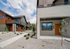 Charming modern apartment exterior with sleek design, vibrant colors, and scenic mountain backdrop.