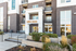 Modern apartment exterior with sleek brick facade and lush landscaping at Moda Newhouse.