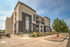 Modern apartment complex with stylish architecture, lush landscaping, and vibrant curb appeal.