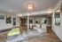 Inviting modern lobby with elegant lighting, stylish seating, and chic decor, perfect for relaxation and socializing.