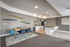 Modern open-concept dining and kitchen area with sleek furniture, stylish decor, and a welcoming ambiance.