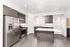 Modern kitchen with stainless steel appliances, sleek cabinetry, and a spacious island, perfect for culinary enthusiasts.