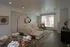 Elegant living and dining area with stylish decor, featuring a cozy sectional sofa, large window for natural light, and a sophisticated dining table setup.